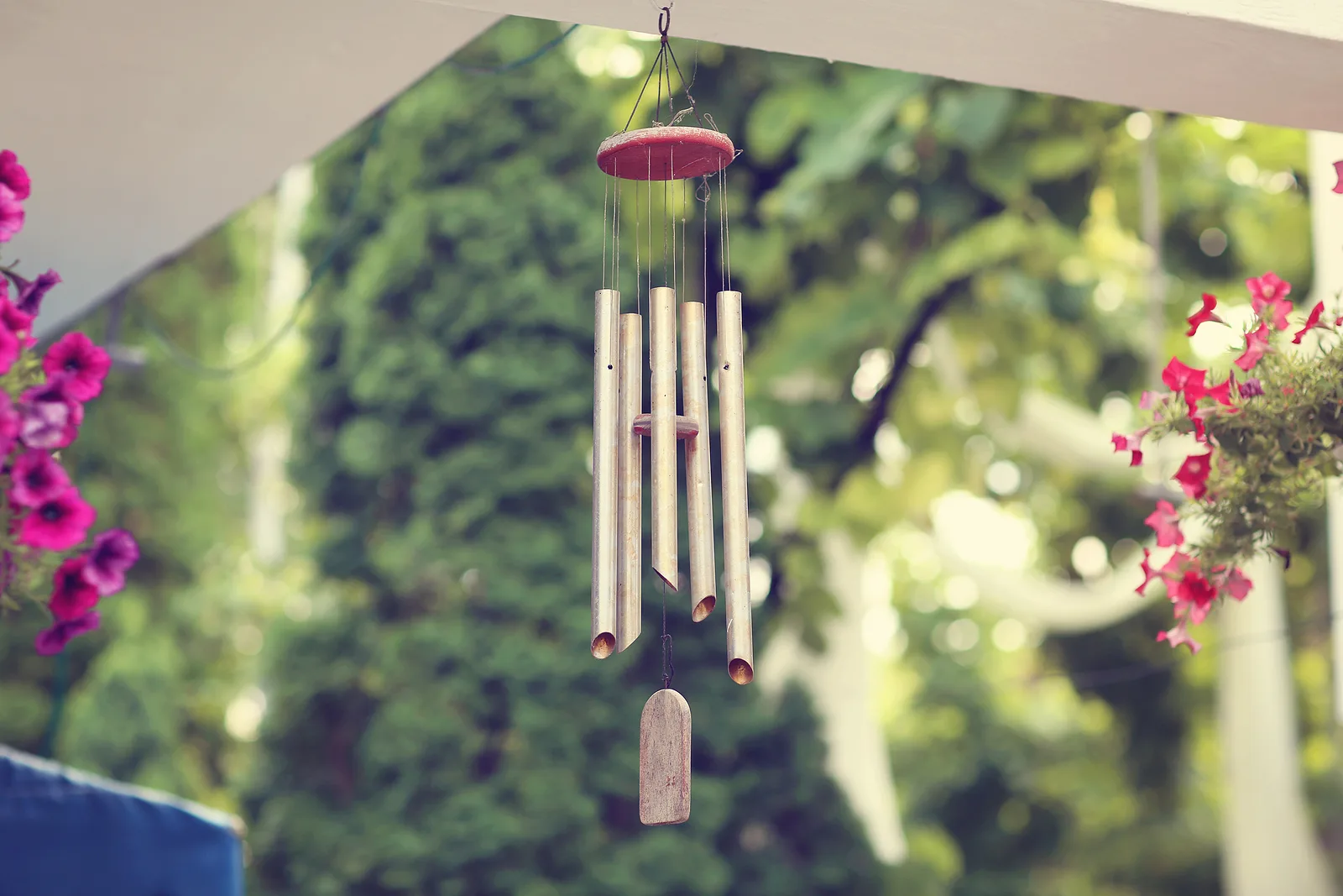 Wind chimes hanging from a porch